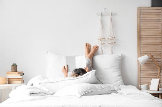 Girl reading on a zero gravity mattress